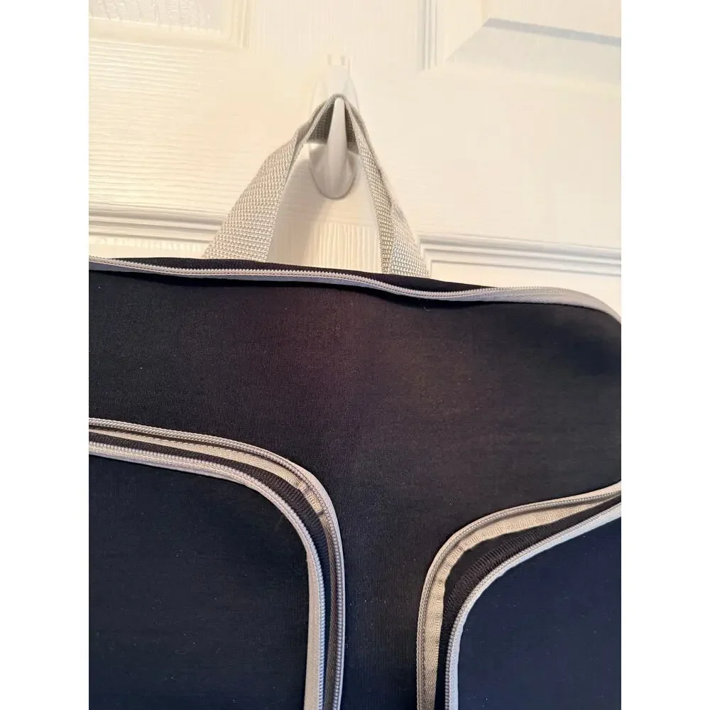 Black laptop sleeve bag features gray zipper compartment carrying handle.